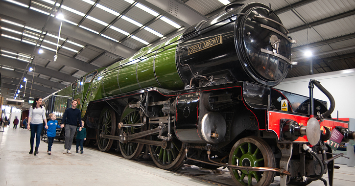 family walking through displays at locomotion 